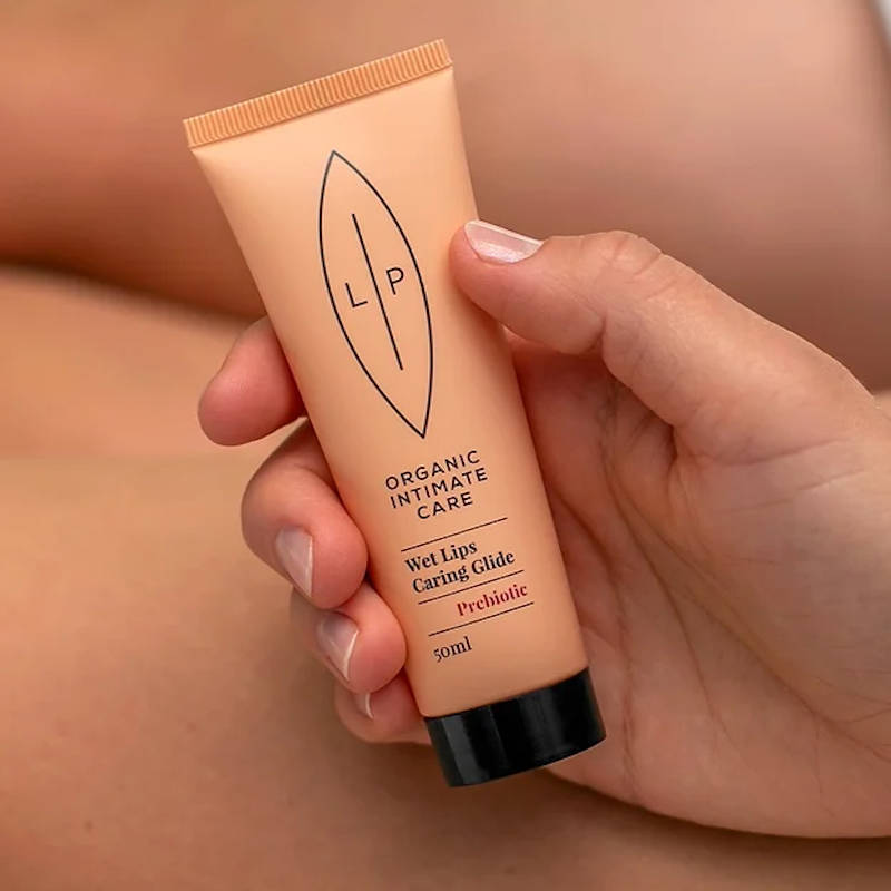 LIP INTIMATE CARE Wet Lips Caring Glide Prebiotic, hand holding tube