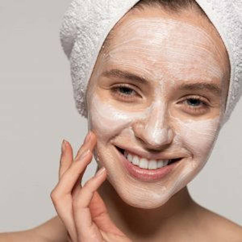 Woman with clay face mask