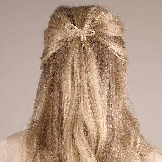CORINNE Haargummi, Bow Metal Plain, cream, in use
