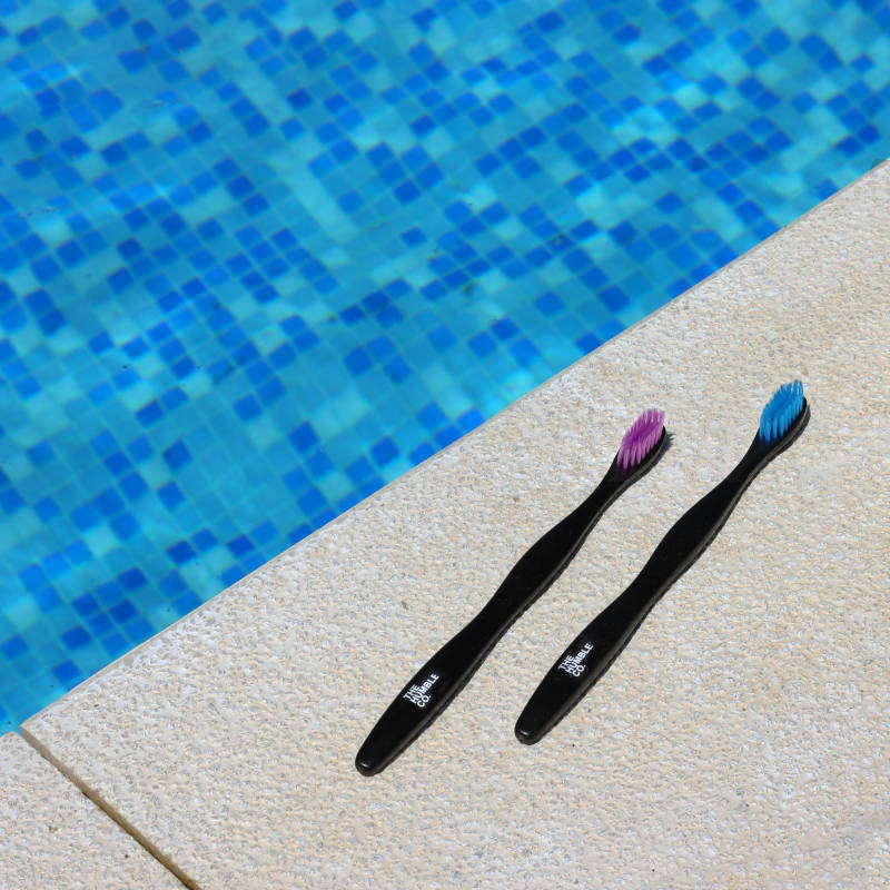 The Humble Co - plant based tooth brushes by a pool
