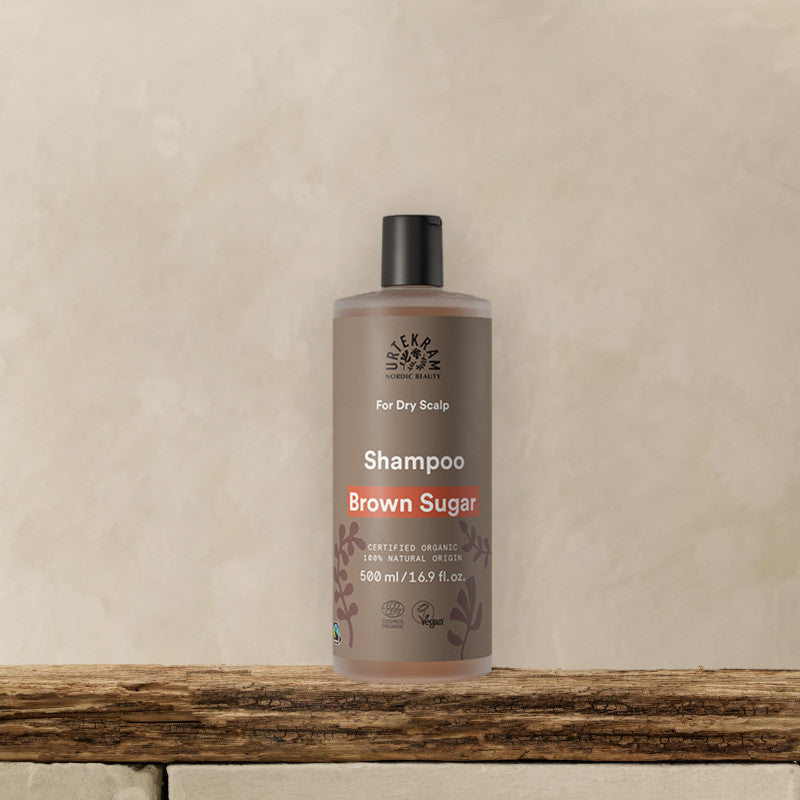 URTEKRAM Shampoo for dry scalp, Brown Sugar. Bottle on a shelf.